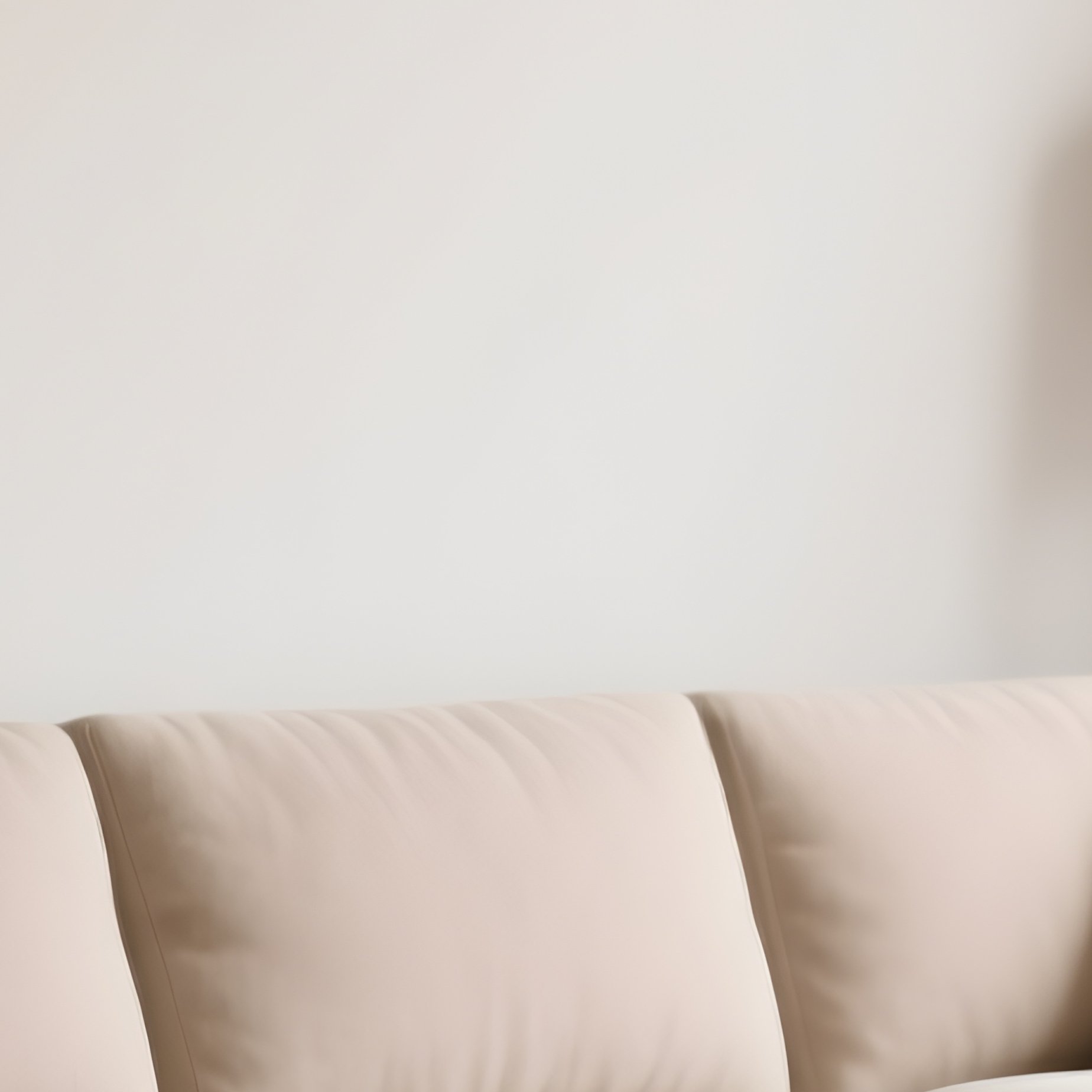 A Calm Living Room Interior With A Neutral Toned Sectional Sofa And Handcrafted Wooden Side Tables - Full Resolution Quality Preview