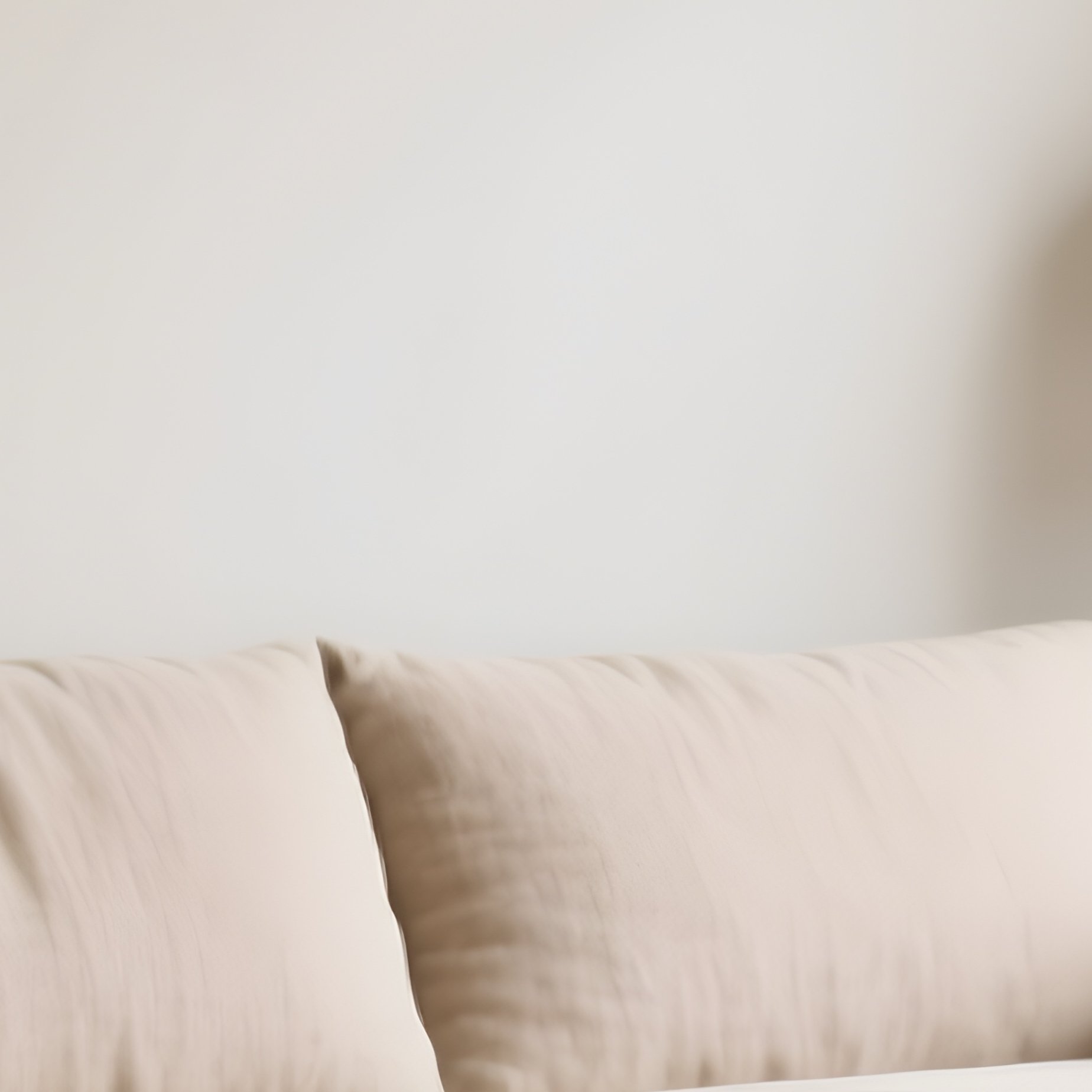 A Calm Living Space With A Linen Sofa And Handcrafted Side Tables - Full Resolution Quality Preview