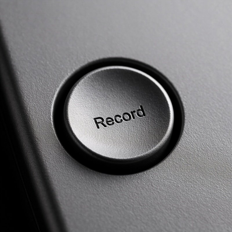 A Grey Button With Deeply Recessed Circle Representing Record But No Ink Or Paint