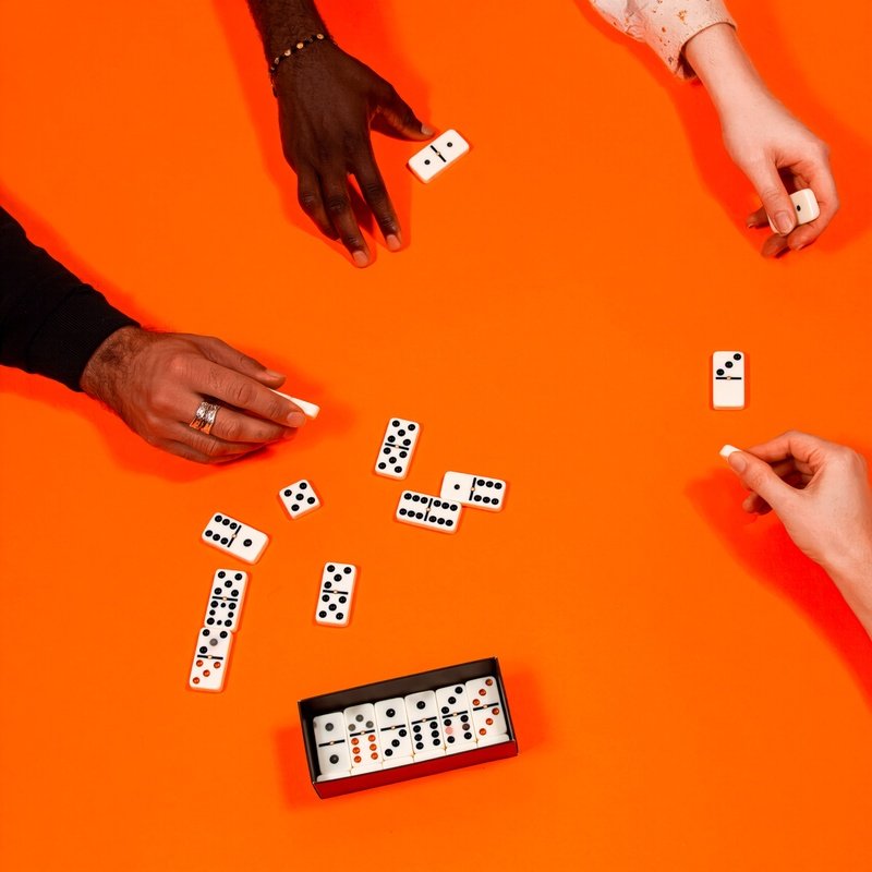 A Group Of Hands Playing Dominoes Dominoes Game