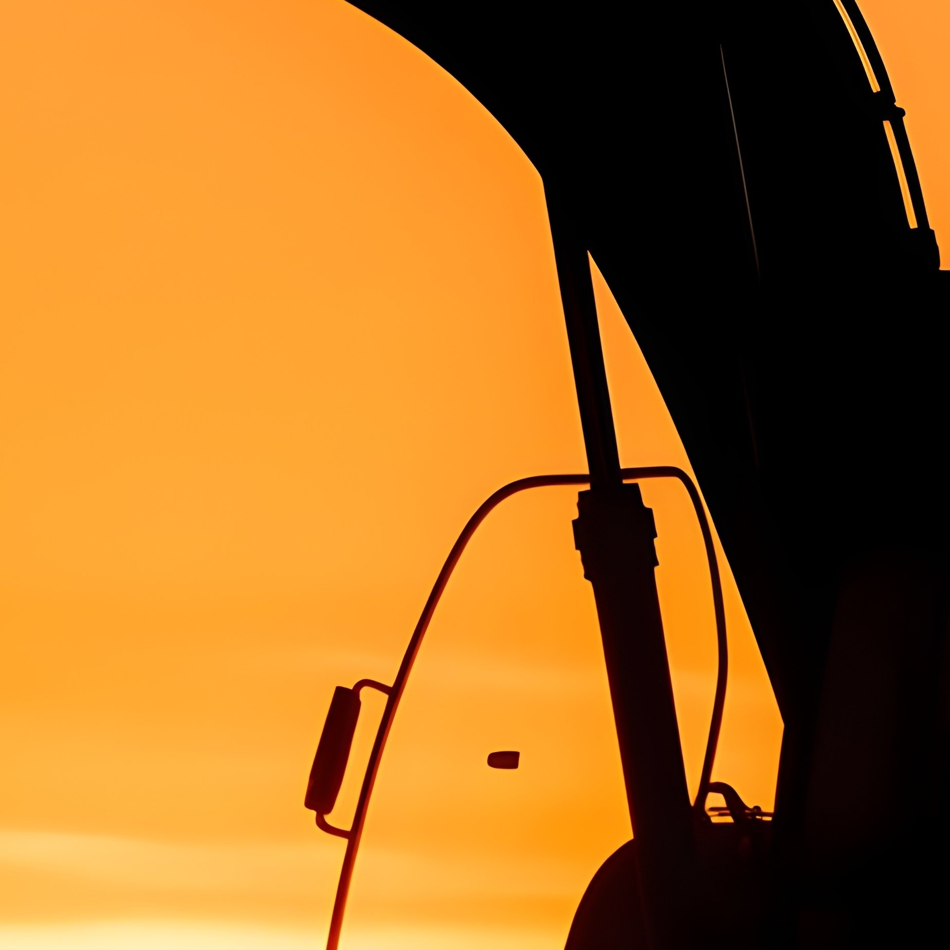 A Large Excavator Silhouetted By Setting Sun - Full Resolution Quality Preview