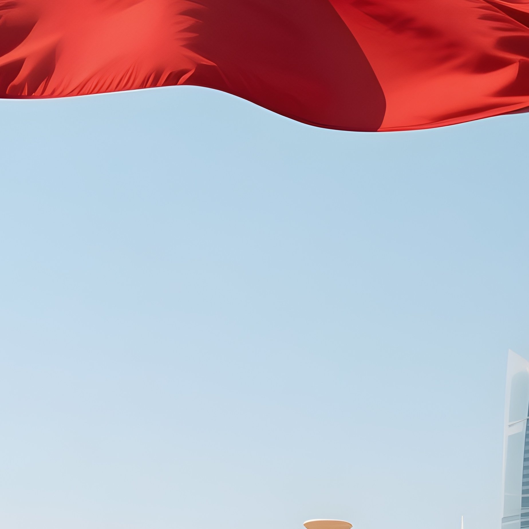 A Photorealistic Kuwaiti Flag Waving Above A Modern Coastal Boulevard. - Full Resolution Quality Preview