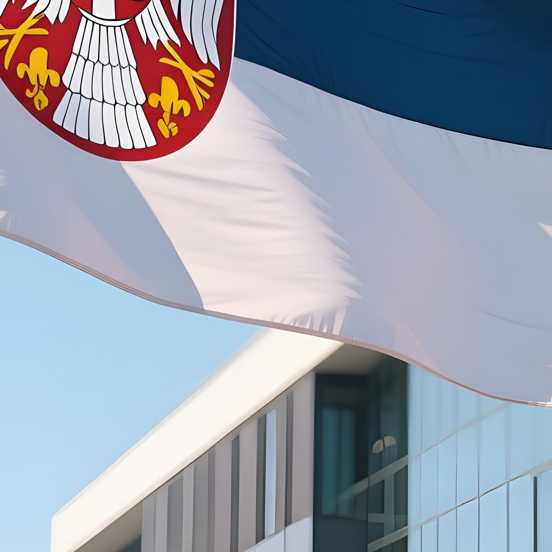 A Photorealistic Serbian Flag Waving Outside A Modern Riverfront Building Under Clear Skies. - Full Resolution Quality Preview