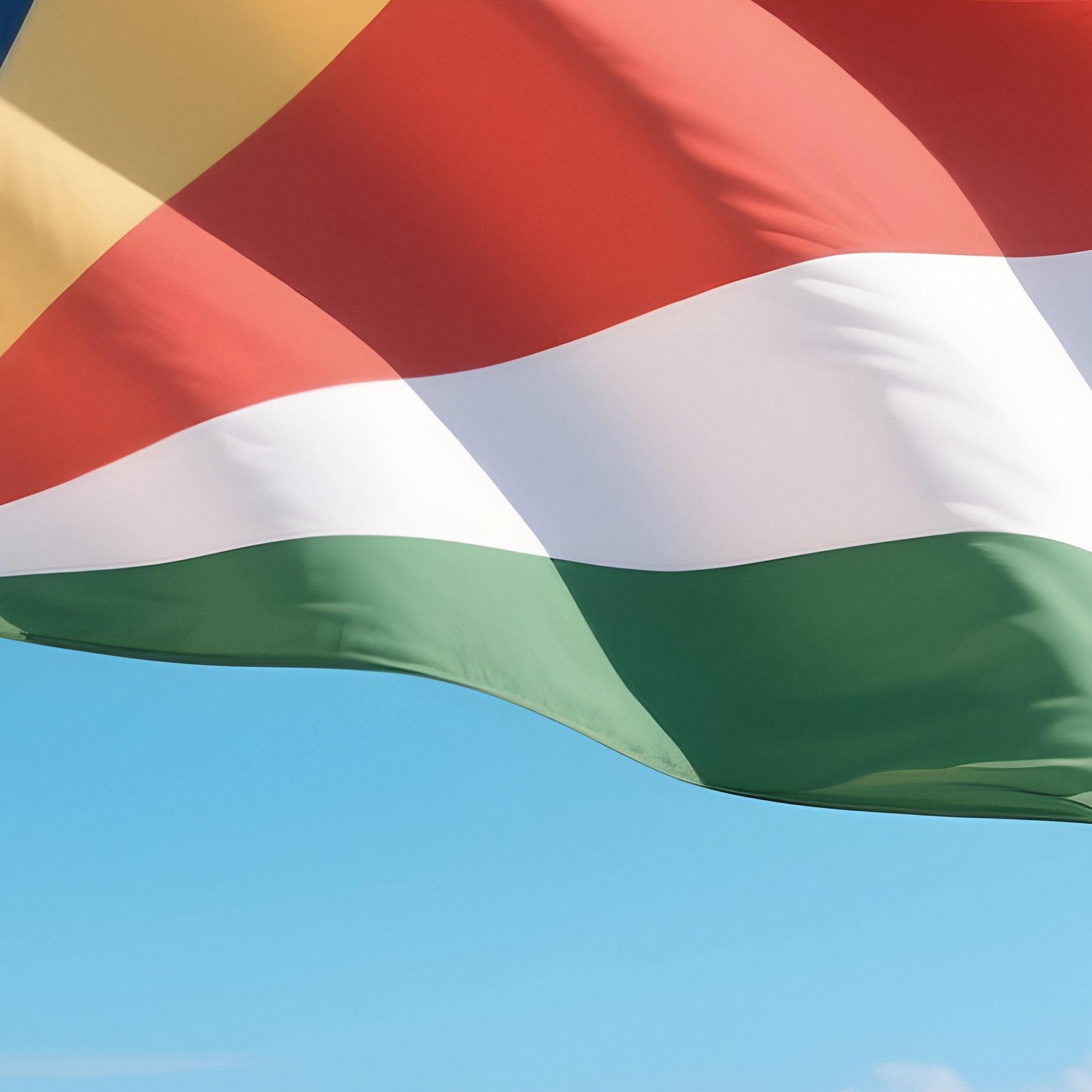 A Photorealistic Seychellois Flag Fluttering Above Pristine White Sand Beaches. - Full Resolution Quality Preview