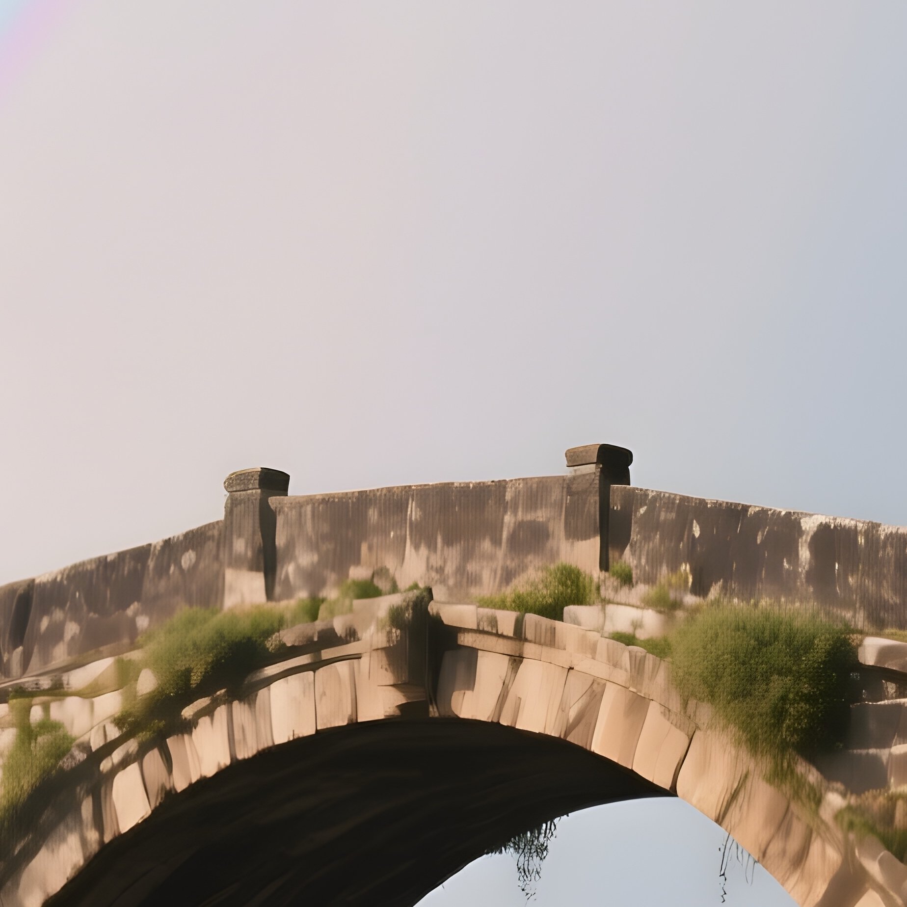 A Rainbow Appearing Above An Ancient Stone Bridge - Full Resolution Quality Preview