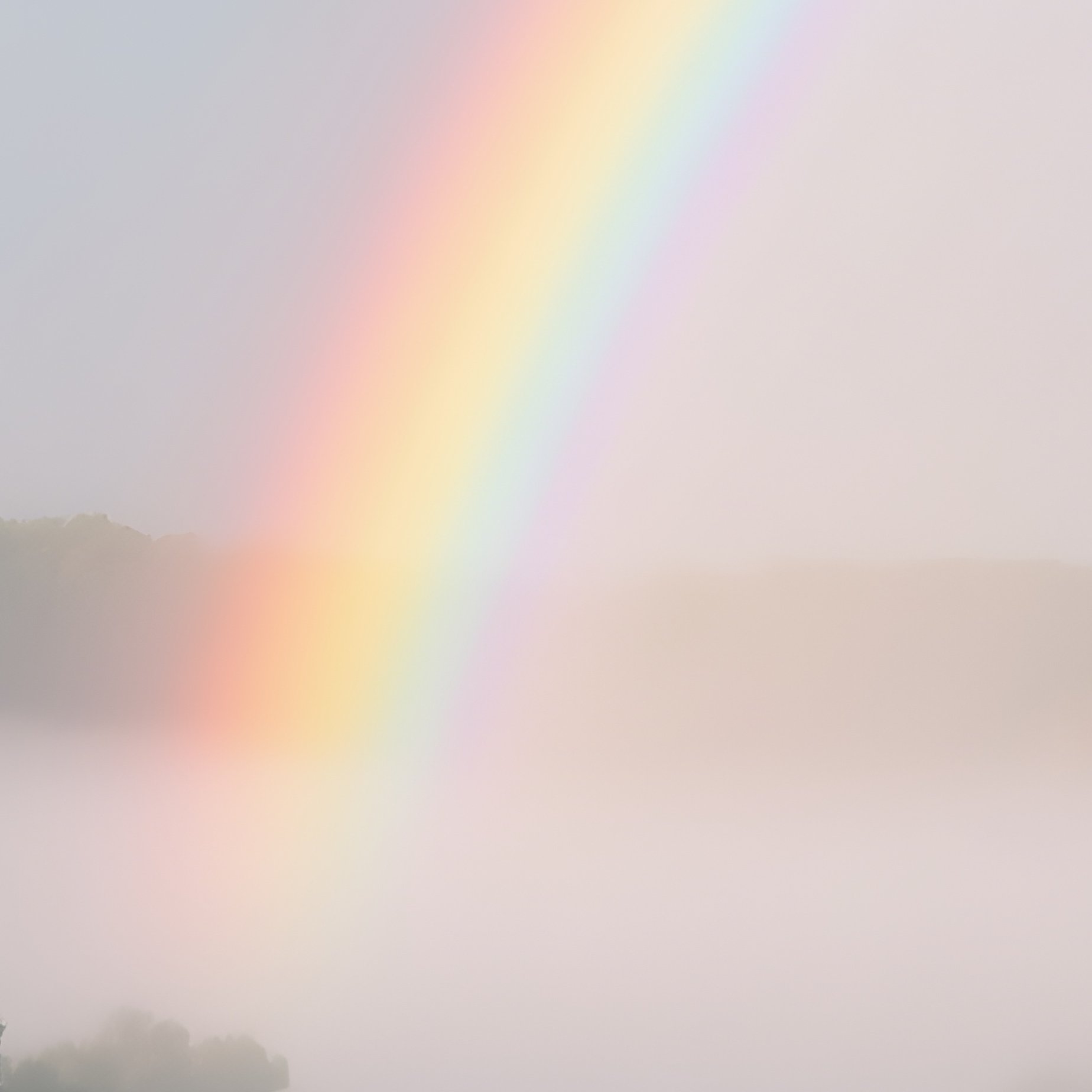 A Rainbow Cutting Through Morning Mist Above A River - Full Resolution Quality Preview