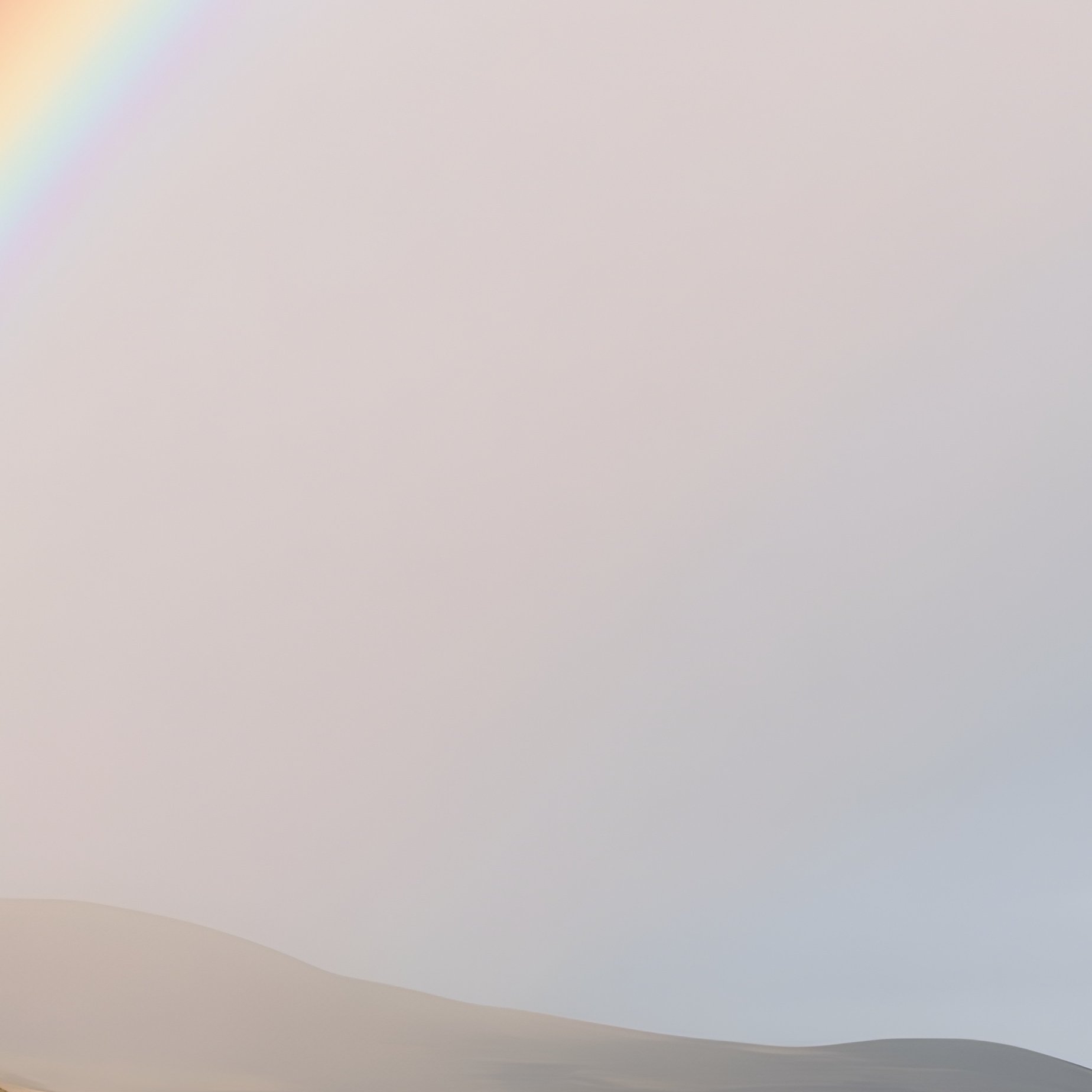 A Rainbow Forming Above A Rugged Coastline - Full Resolution Quality Preview