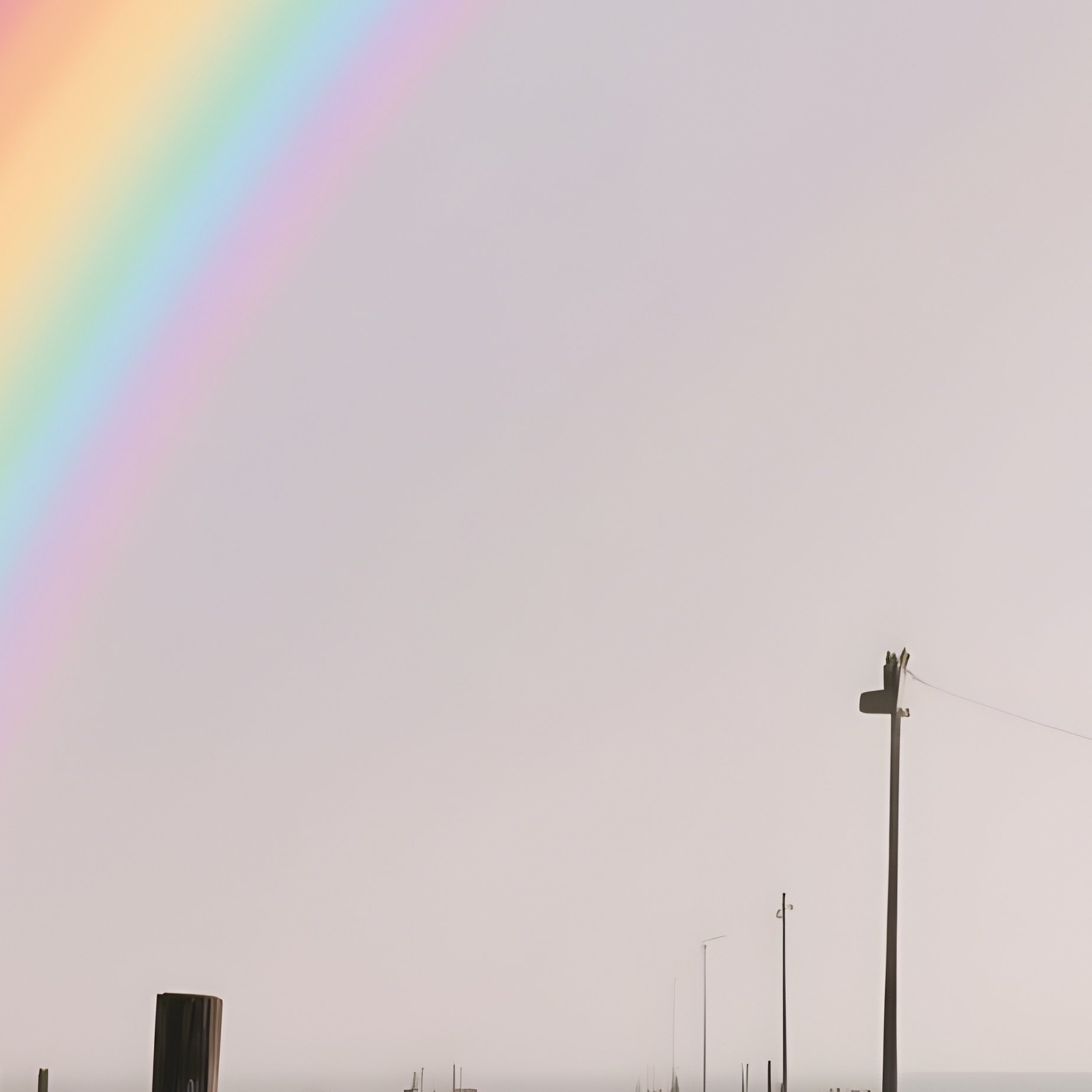 A Rainbow Rising Behind An Abandoned Wooden Pier - Full Resolution Quality Preview