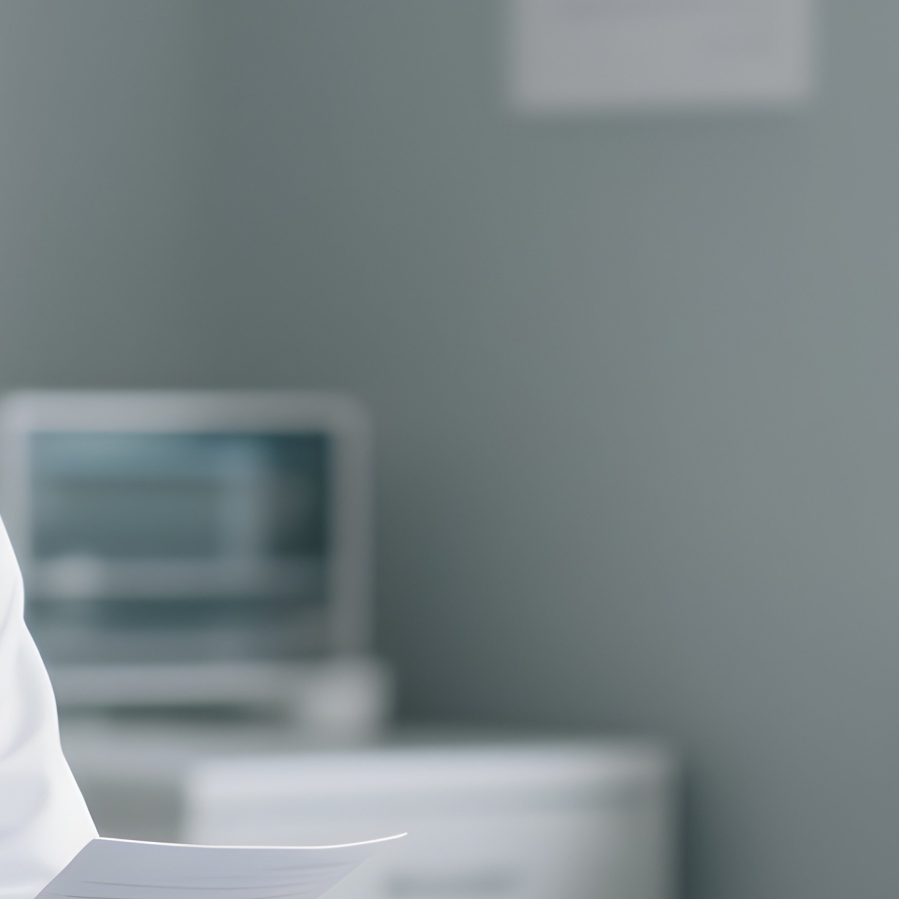 A White Doctor And Black Patient Discussing Results In A Consultation Room. - Full Resolution Quality Preview
