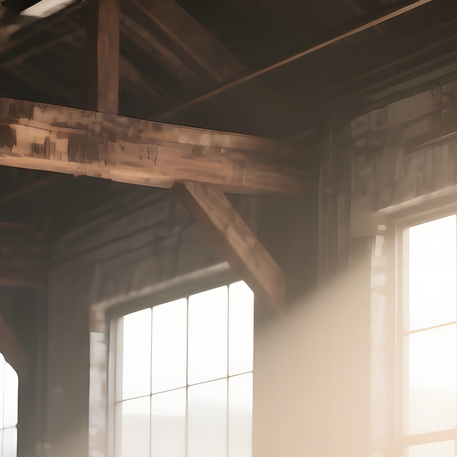 An Industrial Loft With Exposed Reclaimed Barn Wood Beams Overhead, Their Rough Surfaces Catching - Full Resolution Quality Preview
