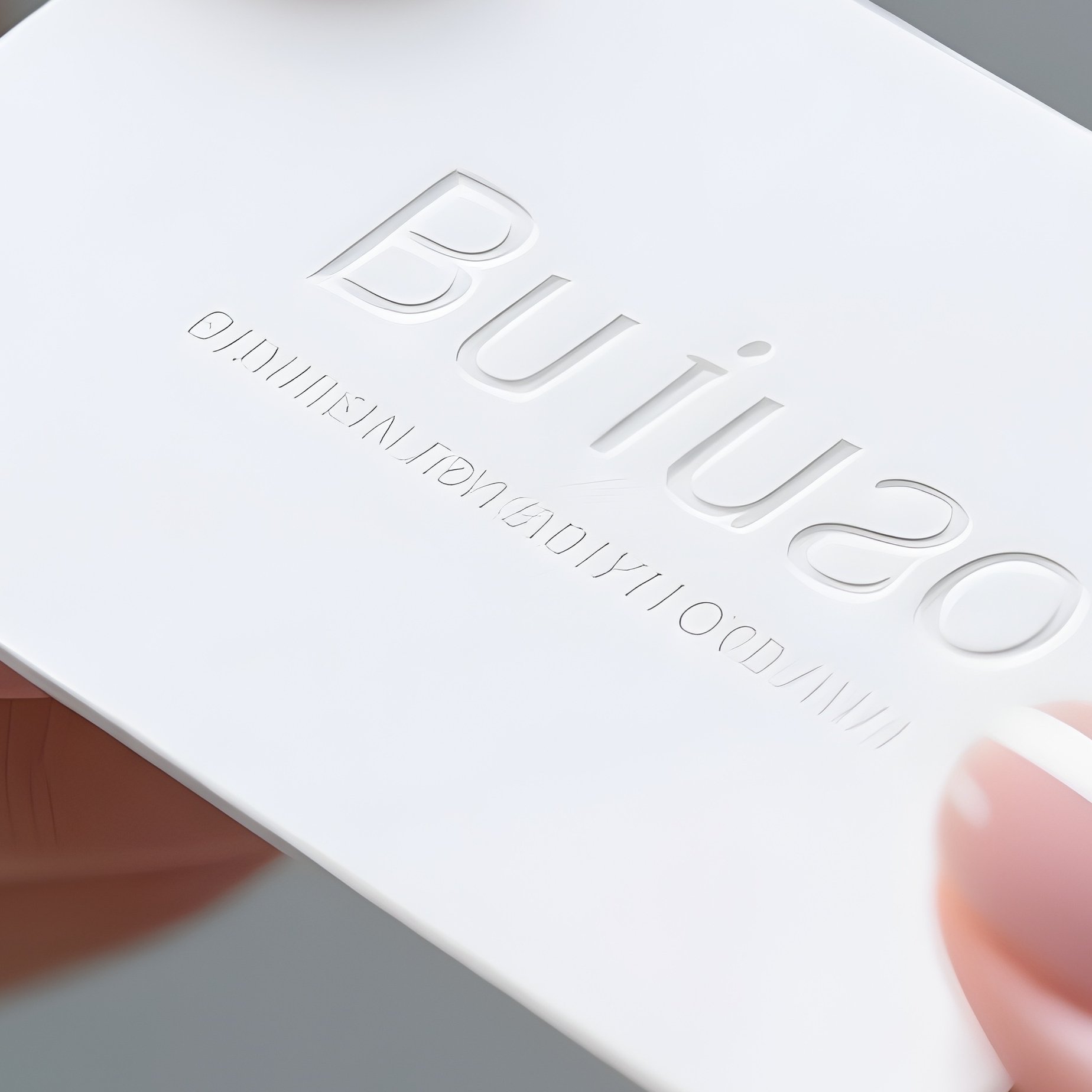 Business Card: A Minimal, Embossed White Business Card Being Handed Over By A Manicured Hand, Focused Shallow Depth Of Field. - Full Resolution Quality Preview