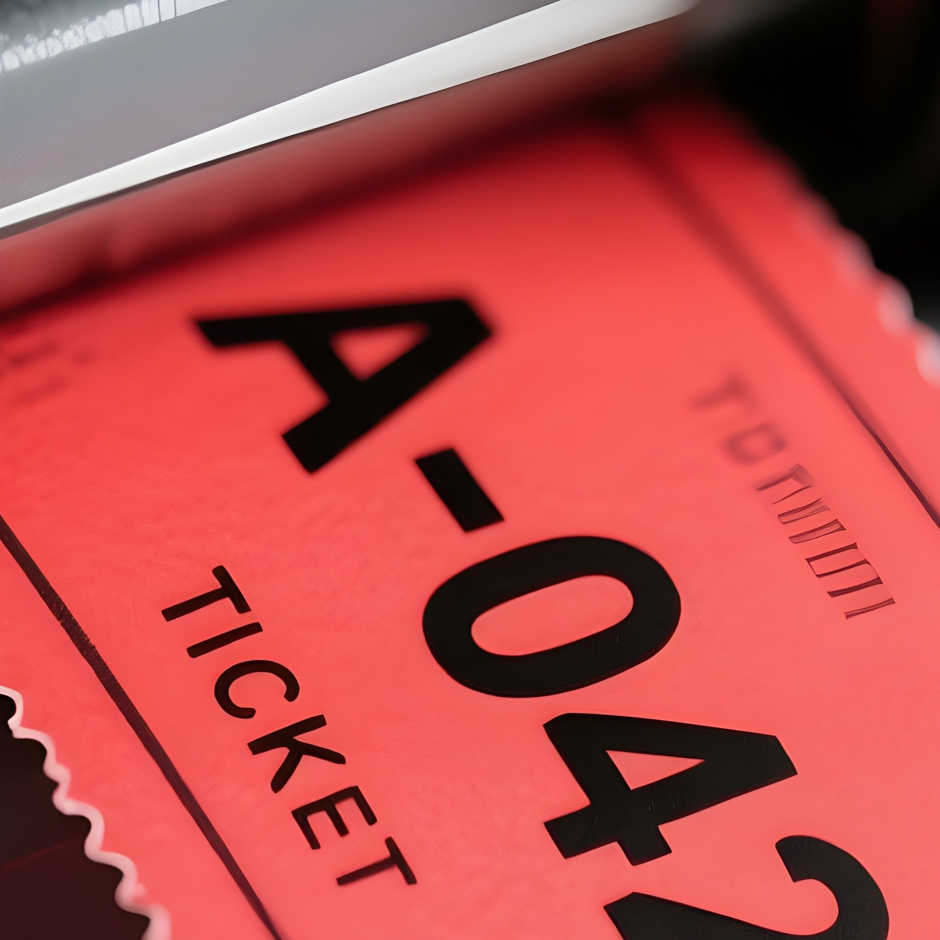 Ticket Machine: A Close Up Of A Red Paper Ticket Being Pulled From A Grey Dispenser Machine, Showing The Number "A 042" In Bold Black Ink. - Full Resolution Quality Preview
